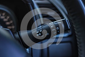 Switch off lights in a car. close-up Car integrated turning indicator with headlight switch toggle.