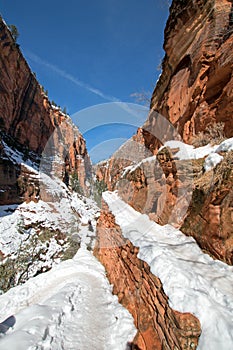 Switchbacks in snow on Angels Landing Hiking Trail during winter in Zion National Park in Utah