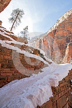 Switchbacks in snow on Angels Landing Hiking Trail during winter in Zion National Park in Utah