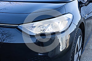 Switched on led lights of luxury car. Car front led Light. Modern car headlamp flashing light with blinking on