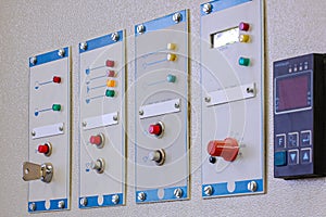 Switches on an industrial control board. Lamp indicator and switch of power control panel