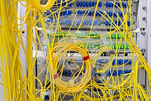 Switching panal with a plurality of optical cables is in the server room photo