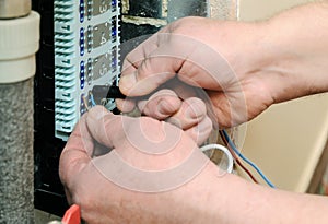 Switching signal wires in the home`s heating system control.