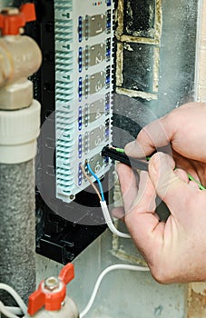 Switching signal wires in the home`s heating system control.