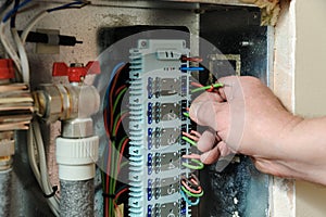 Switching signal wires in the home`s heating system control.