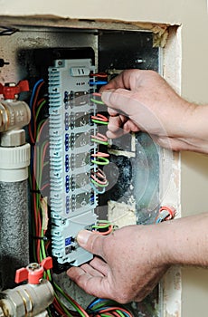 Switching signal wires in the home`s heating system control.