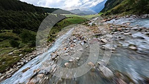 Switzerland alp alpine drone aerial glide fly through and over river. Mountain surfing swiss alps pass Sustenpass