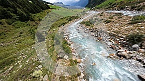 Switzerland alp alpine drone aerial glide fly through and over river. Mountain surfing swiss alps pass Sustenpass