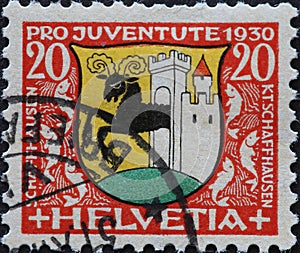 Switzerland - Circa 1930: a postage stamp printed in the Switzerland showing the coat of arms of the city of Schaffhausen in Switz