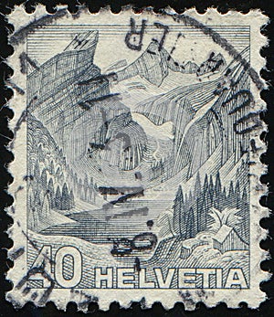 SWITZERLAND - CIRCA 1936: stamp 40 Swiss centimes printed by Swiss Confederation, shows Seealp Lake & Santis Mountain landscape