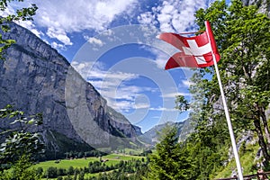 Switzerland flag near TrÃ¼mmelbach waterfalls