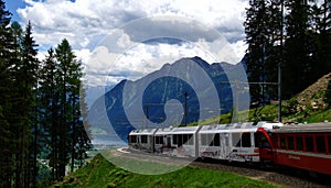 The famous Red Train Railway with Bernina Express Train going to the Alps