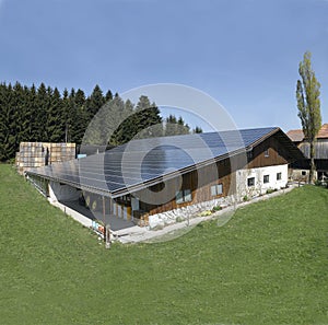 Switzerland: Solar energy panel on the roof of a farmhouse