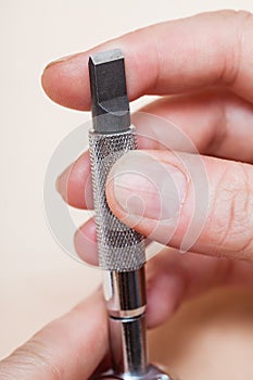 Swivel knife in hand close up