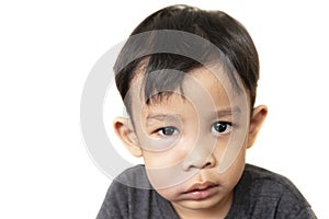 Swollen face of asian kid suffering from health problem and aching tooth photo