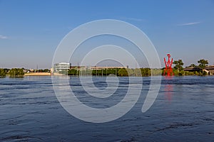 Swollen Missouri River at Omaha Nebraska Riverfront flooding Tom Hanafan River`s edge park in Council Bluffs Iowa