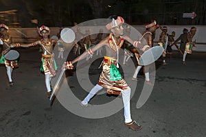 Sword Dancers perform along the streets of Kandy during the Esala Perahara in Sri Lanka.