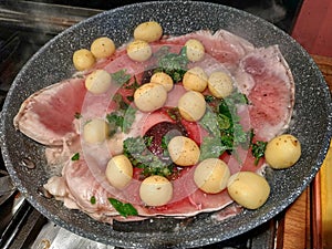 Pan cooking slices of swordfish