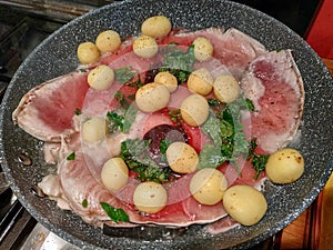 Pan cooking slices of swordfish
