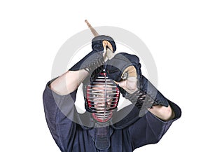 Swordsman in attacking position and protective equipment `bogu`