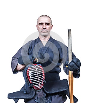 Swordsman dressed in protective equipment `bogu` with bamboo sw