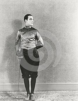 Swordsman posing with fencing foil