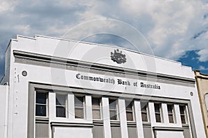 Historical old buildings of Commonwealth Bank in Newtown with Coat of arms of Australia in classic version.