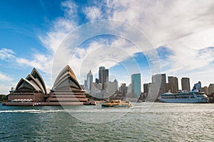 Sydney cityscape with Opera house and ferry boat