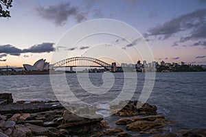 Sydney harbor skyline at sunset with Sydney harbor bridge, NSW, Australia