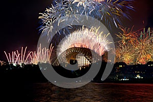 Sydney Harbour Bridge New Years Eve fireworks, colourful NYE fire works lighting the night skies with vivid multi colours