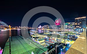 Sydney Harbour Bridge at night and CBD buildings on the foreshore in NSW Australia