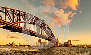 Sydney Harbour Bridge and Opera House at golden sunset