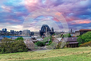 Sydney Harbour viewed from Observatory Park and overlooking Sydney Rocks area and North Sydney with colourful skies NSW Australia