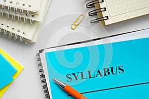Syllabus educational plan and papers on the desk. photo