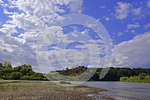 The Sylva River and Mount Lobach against the background of the summer sky