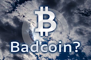 The symbol of bitcoin and the inscription `Badcoin?` photo