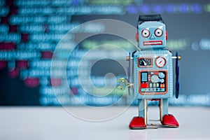 Symbol for a chatbot or social bot and algorithms, program code in the background photo