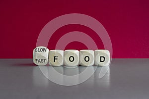 Symbol for the decision of having fast food or slow food. Turned a cube and changes the word fast food to slow food. Beautiful