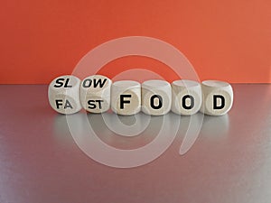 Symbol for the decision of having fast food or slow food. Turned wooden cubes and changes the word fast food to slow food.
