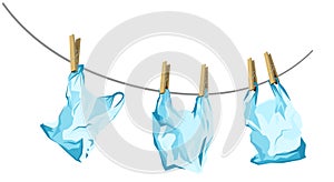 Symbol of environmental pollution of the planet with plastic, non-degradable debris. cellophane bags are dried on a rope