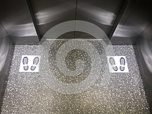 Symbol of footprint after used for social distancing in elevators.