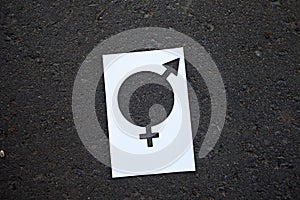 Symbol of gender equality on the background of asphalt