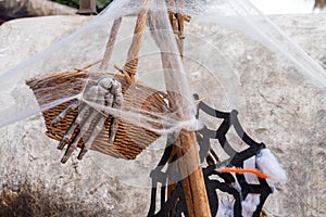 Symbol of Halloween - skeleton arm on city market with some spider net decorations