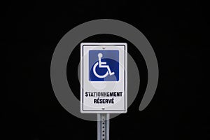 Symbol of handicap disabled parking space on a black background