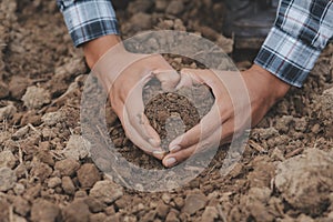 Symbol heart earth day. Handful of dirt hands heart shape. Farm organic earth. Farmer hands soil ground earth dirt garden soil