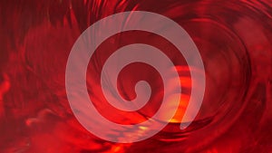 Symbol of hell, inferno and infinity. Red liquid hypnotic looped aqua swirl turning. Meditative luminous whirlpool. Mesmerising