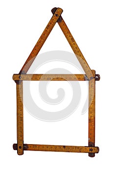 Symbol of house made of old yardstick photo