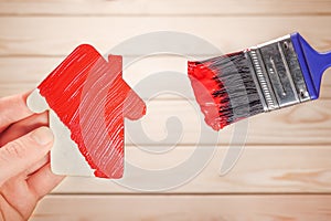 Symbol house painting brush in red colour. New home remodeling renovation paint facade. Painting work house icon