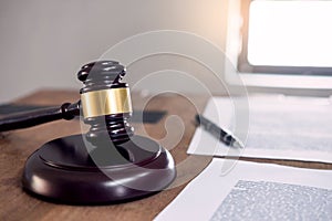 Symbol of Judge law attorney gavel with Justice lawyers table desktop, workplace with documents