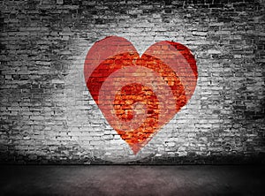 Symbol of love painted on murky brick wall photo